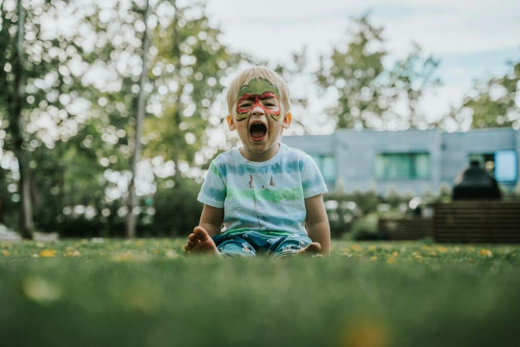 child playing on grass